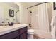 Bathroom featuring a combination shower and tub, light green walls, and dark wood vanity at 461 S Kalispell Way # D, Aurora, CO 80017