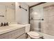 Bathroom with modern vanity, framed mirror and shower with glass door and tiled surround at 461 S Kalispell Way # D, Aurora, CO 80017
