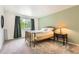 The bedroom features a decorative lamp, large window, and neutral paint at 461 S Kalispell Way # D, Aurora, CO 80017