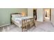 This bedroom features carpeted floors, walk-in closet, and a soft green accent wall at 461 S Kalispell Way # D, Aurora, CO 80017