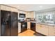 Bright kitchen with white cabinetry, granite countertops, and stainless steel appliances at 461 S Kalispell Way # D, Aurora, CO 80017