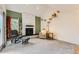 Cozy living room with a white stone fireplace and a unique cat climbing wall at 461 S Kalispell Way # D, Aurora, CO 80017