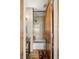 Hallway bathroom featuring a vanity and shower/tub combo with beige tile at 107 Elk Dr, Evergreen, CO 80439