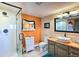 Bright bathroom featuring a walk-in shower and modern vanity at 107 Elk Dr, Evergreen, CO 80439