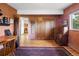 Bedroom featuring hardwood floors, a window, closet and bureau storage at 107 Elk Dr, Evergreen, CO 80439