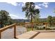 Spacious deck with wooden railing and scenic mountain views at 107 Elk Dr, Evergreen, CO 80439