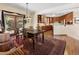 Dining room with wood table, a vintage rug, and sliding doors to the backyard at 107 Elk Dr, Evergreen, CO 80439