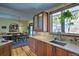 Modern kitchen featuring updated cabinets and countertops, and an adjacent dining area at 107 Elk Dr, Evergreen, CO 80439