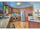 Contemporary kitchen featuring stainless steel appliances, wood cabinetry, and ample counter space at 107 Elk Dr, Evergreen, CO 80439