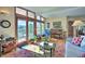 Bright living room with mountain views, large windows, and comfortable seating at 107 Elk Dr, Evergreen, CO 80439