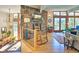 Inviting living area featuring a stone fireplace, hardwood floors, and natural light at 107 Elk Dr, Evergreen, CO 80439