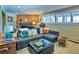 Comfortable living room with ample seating, natural light, and cozy decor for a relaxing atmosphere at 107 Elk Dr, Evergreen, CO 80439