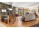 Comfortable living room featuring a stone fireplace, hardwood floors, and sliding glass doors at 107 Elk Dr, Evergreen, CO 80439
