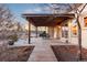 Outdoor patio area with pergola and dining set, perfect for entertaining at 8187 N Pinewood Dr, Castle Rock, CO 80108