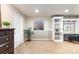 Finished basement with built-in shelving, neutral carpet, natural light from a window and a small plant at 8187 N Pinewood Dr, Castle Rock, CO 80108