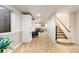 Finished basement area features neutral carpet, white built-in shelving and stairs to the upper level at 8187 N Pinewood Dr, Castle Rock, CO 80108