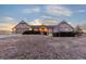 Charming stone and wood home featuring dormer windows and an attached two car garage at 8187 N Pinewood Dr, Castle Rock, CO 80108