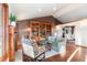 Inviting living area with hardwood floors, a fireplace, and decorative built-in shelving at 8187 N Pinewood Dr, Castle Rock, CO 80108