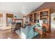 Bright living room features hardwood floors, a fireplace, and decorative built-in shelving at 8187 N Pinewood Dr, Castle Rock, CO 80108