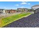 View from the back of the home showcasing the backyard with a white fence at 5336 Trails Edge Ln, Castle Rock, CO 80104