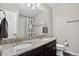 Elegant bathroom with double vanity, granite countertop, and modern fixtures at 5336 Trails Edge Ln, Castle Rock, CO 80104