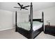 The primary bedroom includes a four-poster bed, ceiling fan, and a dresser at 5336 Trails Edge Ln, Castle Rock, CO 80104