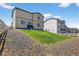 View of the home from the backyard, showing the upper and lower levels at 5336 Trails Edge Ln, Castle Rock, CO 80104