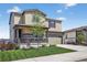 Two-story home with a covered front porch, a well-kept lawn and landscaping plus an attached garage at 5336 Trails Edge Ln, Castle Rock, CO 80104