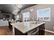 Updated kitchen island with granite countertops, stainless sink and open to the dining area at 5336 Trails Edge Ln, Castle Rock, CO 80104