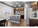 Modern kitchen island with granite countertops and stainless steel appliances, great for cooking and entertaining at 5336 Trails Edge Ln, Castle Rock, CO 80104