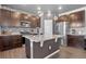 Modern kitchen with stainless steel appliances, granite countertops, and stylish backsplash at 5336 Trails Edge Ln, Castle Rock, CO 80104