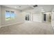 Spacious finished basement with neutral carpet and bright natural light from a large window at 9374 Quartz St, Arvada, CO 80007