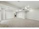 Large finished basement featuring plush carpeting, recessed lighting, and white walls at 9374 Quartz St, Arvada, CO 80007