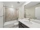 Bathroom featuring tile shower, dark wood vanity, a white countertop and an oval sink at 9374 Quartz St, Arvada, CO 80007