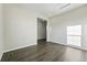 Neutral bedroom featuring dark wood flooring and neutral walls, offering a tranquil and versatile living space at 9374 Quartz St, Arvada, CO 80007
