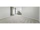 Upstairs hallway and neutral carpet in a light and airy space at 9374 Quartz St, Arvada, CO 80007