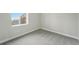 Bedroom with plush carpeting and a large window providing natural light at 9374 Quartz St, Arvada, CO 80007