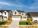 Charming two-story home with a well-manicured lawn and a two-car garage at 9374 Quartz St, Arvada, CO 80007
