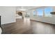 Open-concept living area boasting hardwood floors, natural light, and seamless flow into the kitchen and outdoor spaces at 9374 Quartz St, Arvada, CO 80007