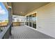 A covered outdoor patio with sliding glass doors offers an extension of indoor and outdoor living space at 9374 Quartz St, Arvada, CO 80007