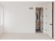 Bright bedroom with neutral carpet that provides an entrance into a modern bathroom space at 4135 Benton Street, Denver, CO 80212