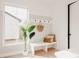 Inviting entryway with a bench, coat hooks, and natural light streaming through the window at 4135 Benton Street, Denver, CO 80212