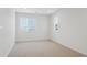 Bright bedroom with neutral carpeting and large windows at 811 Goodrich Peak St, Erie, CO 80516