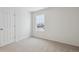 Bright bedroom with neutral carpeting and window at 811 Goodrich Peak St, Erie, CO 80516