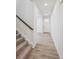 Bright entryway with light hardwood floors and staircase at 811 Goodrich Peak St, Erie, CO 80516