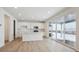 Modern kitchen with white cabinets, island and sliding glass doors at 811 Goodrich Peak St, Erie, CO 80516