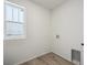 Laundry room with vinyl flooring and window at 811 Goodrich Peak St, Erie, CO 80516