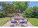 Relaxing backyard with a charming fire pit, comfortable seating, and privacy fence at 1774 S Dover Way, Lakewood, CO 80232
