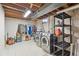 Bright laundry room with washer, dryer, shelving, and storage space for household tasks at 1774 S Dover Way, Lakewood, CO 80232
