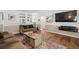 Cozy living room with hardwood floors, neutral paint colors, and stylish decor at 1774 S Dover Way, Lakewood, CO 80232